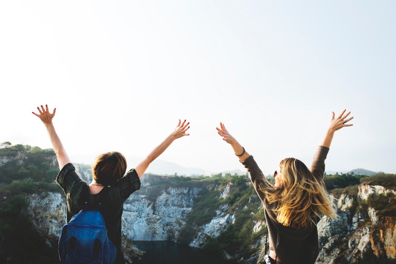 girls-handsup-cheerful