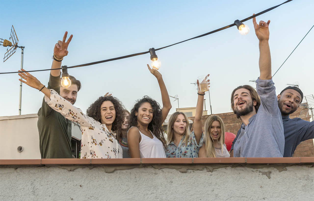 Rooftop party scene, dancing