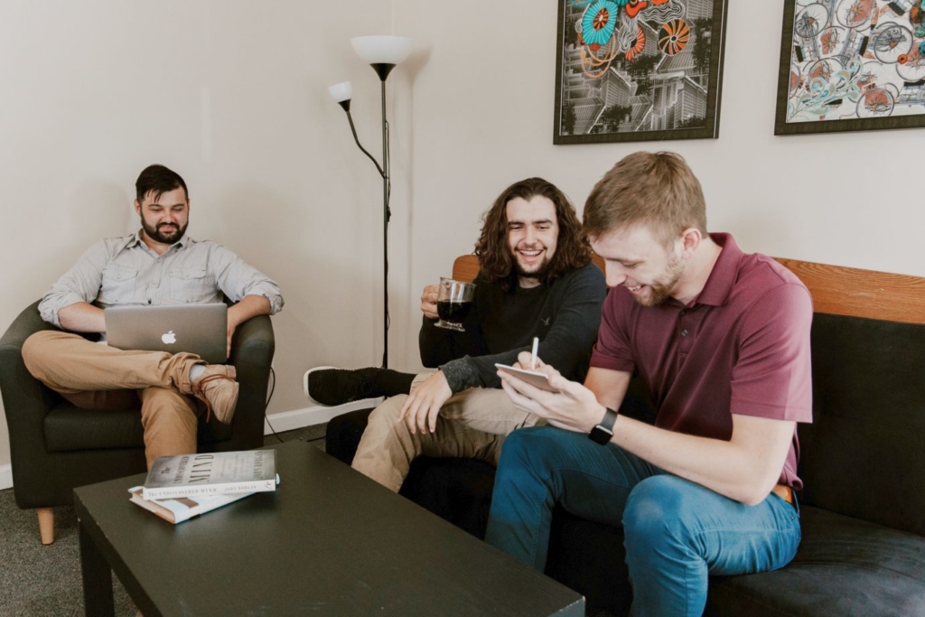 men-smile-meeting